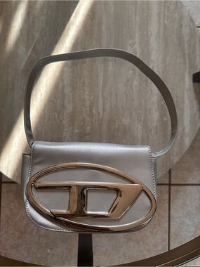 Silver Shoulder Bag with Gold-Tone Oval Emblem